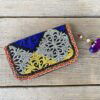 Prachtige en unieke portemonnee met de hand afgewerkt met vintage stoffen uit India. Elke portemonnee is uniek en handmade.